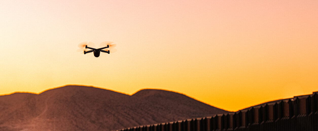 Ominous Uav Drone Flying Above The Us Mexico Border Near El Paso, Texas At Sunrise Or Sunset