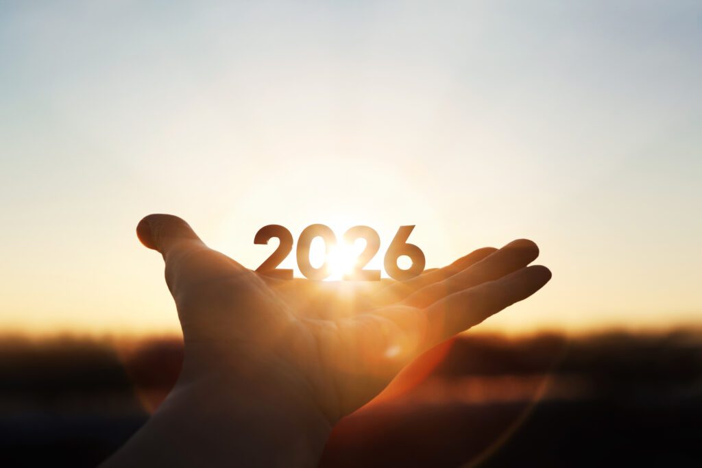 Bright Sunlight Shining Through Hands And Sunrise Background For New Year 2026
